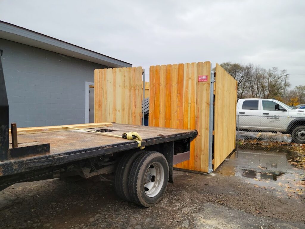 Commercial wood dumpster enclosure installation in Davison, Michigan